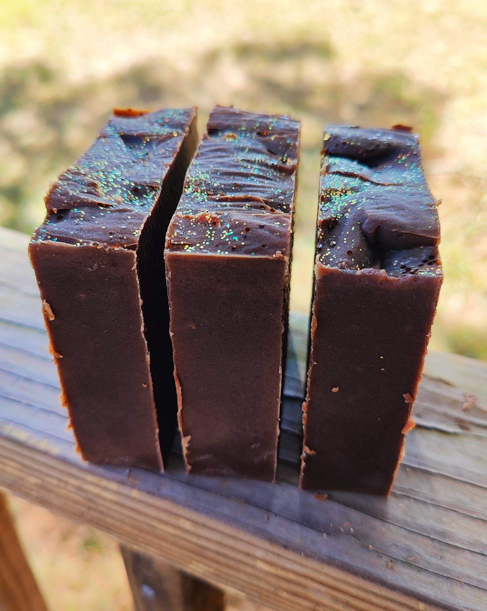 Collection of freshly made sugar and spice goat milk soap bars showing handmade details