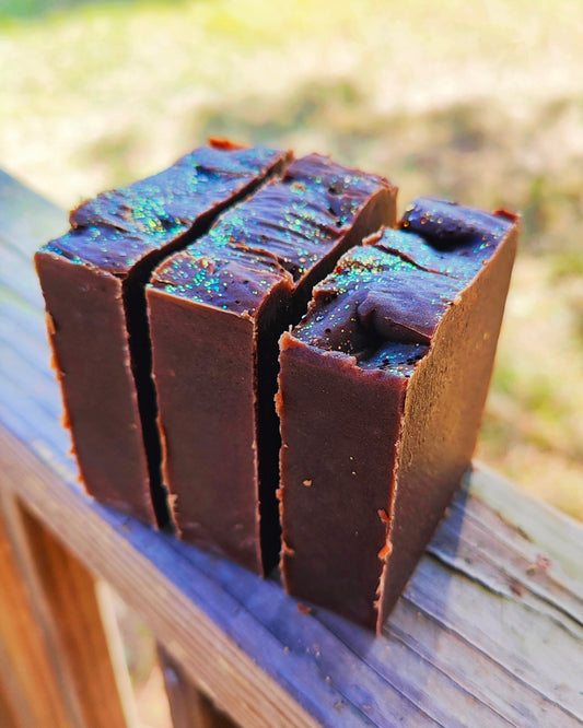 Handmade sugar and spice goat milk tallow soap bar showing texture and color